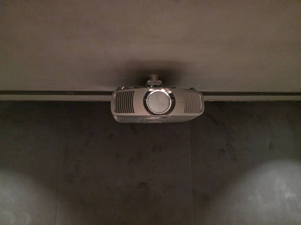 The 4K laser projector on its ceiling mount