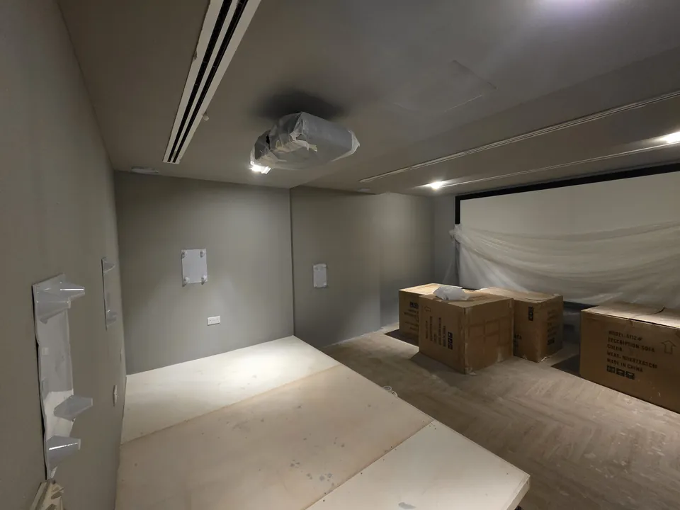 The seating riser built and the screen wrapped for protection before the seats arrive