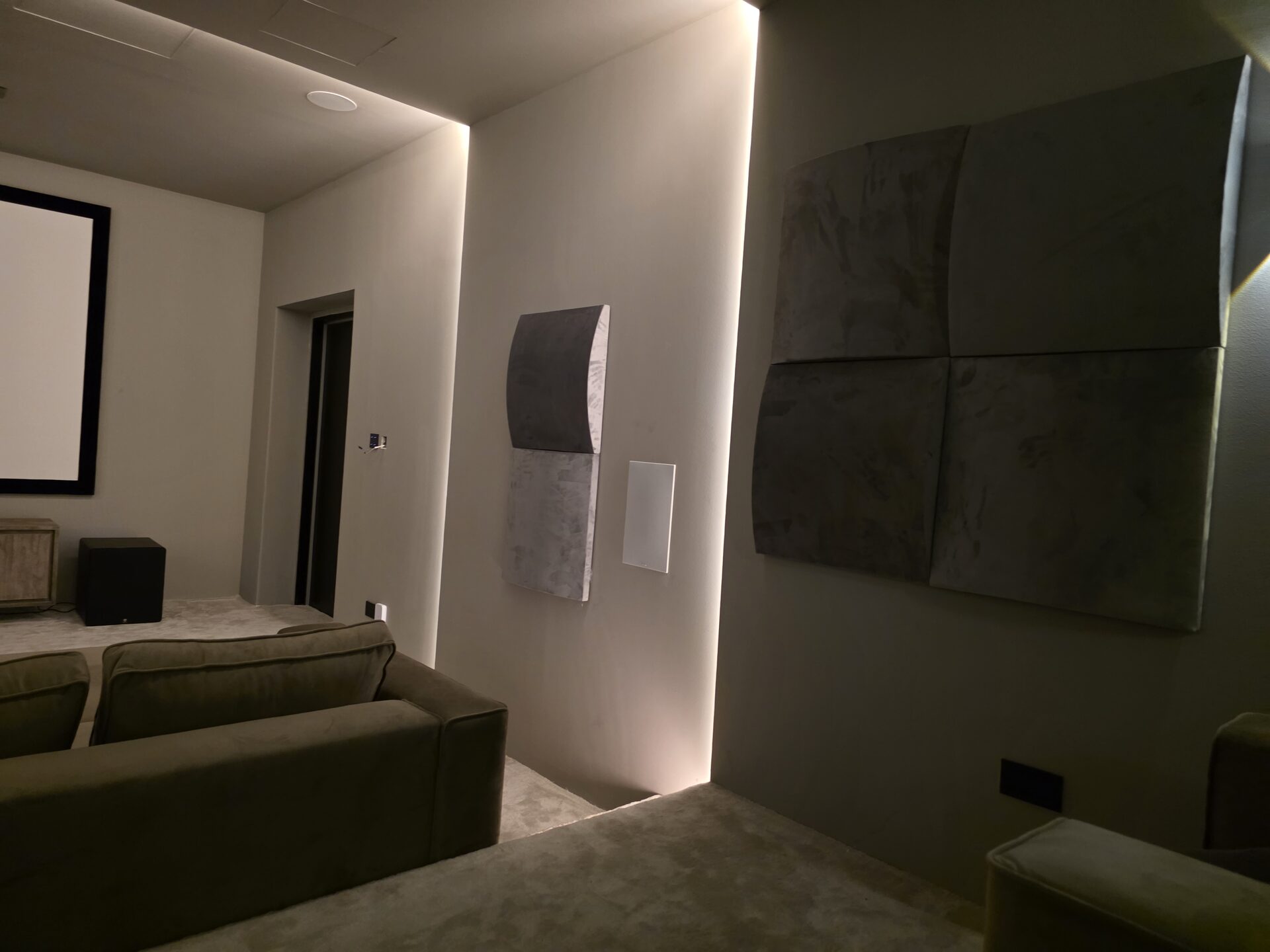 Home cinema in a villa in Dubai Hills, with acoustic panels and an in-wall speaker