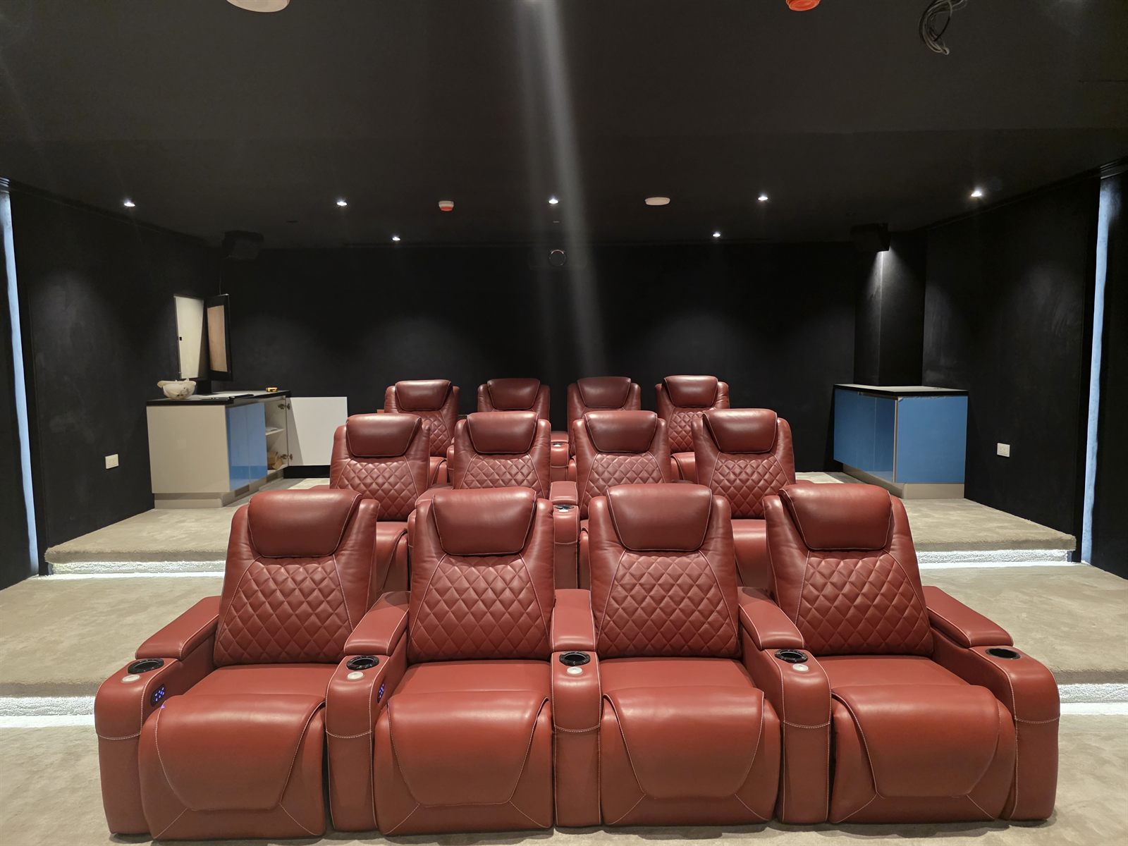 Reclining seats with built-in controls in the Society House home cinema